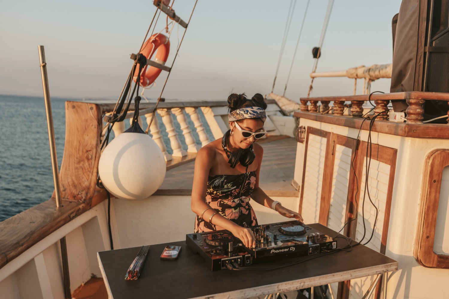 DJ Near Me (Jasmine Lee) playing a sunset set on deck